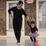 Toddler and Caregiver Dancing